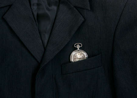 men's dark jacket in small stripes with vintage watch in pocketの写真素材