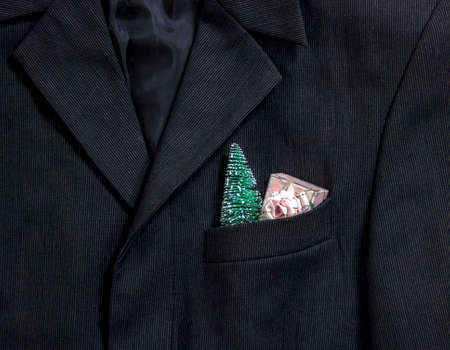 men's dark jacket in fine stripes collar pocket sleeve in the pocket Christmas tree and gift with bow pink packageの写真素材