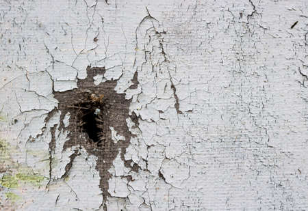 on canvas with paints acrylic oil hole bullet thread torn blueの写真素材