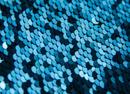 texture background round paillettes of silver color dark and light shineの写真素材