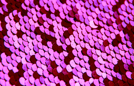 texture background round paillettes of silver color dark and light shine pink redの写真素材