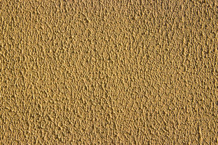 texture wall yellow stuccoの写真素材