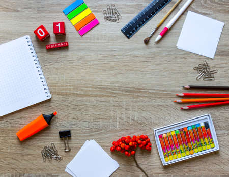 on a wooden background stationery note pad pencil ashberry autumn calendar cubes copy spaceの写真素材