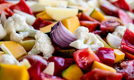 sliced vegetables autumn different colors a piece of onionの写真素材