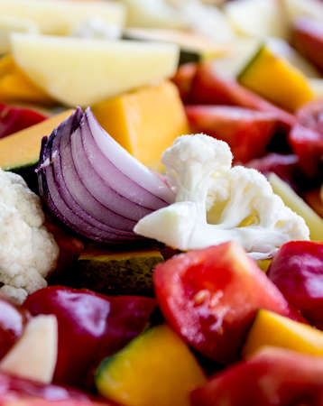 sliced vegetables autumn different colors a piece of onionの写真素材
