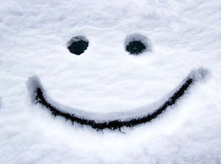 smiling face in the snow eyes and mouth smileの写真素材