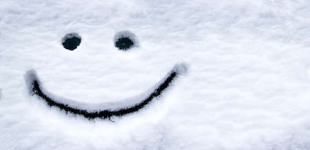 smiling face in the snow eyes and mouth smileの写真素材