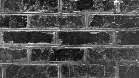 old imitation of a brick wall of concrete with cracksの写真素材