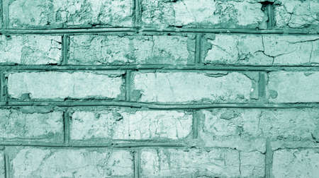 old imitation of a brick wall of concrete with cracksの写真素材