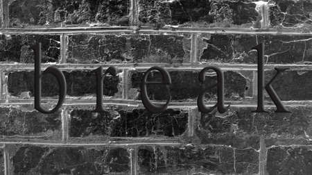 old imitation of a brick wall of concrete with cracksの写真素材
