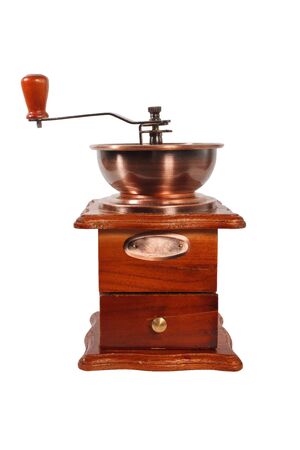Old manual coffee grinder in brown wood case with handle on white background. Coffee grinder isolated. Coffee grinder isolated on white backgroundの写真素材