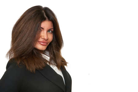 portrait of a friendly smiling young woman businessman secretary student with dark hair on a white isolated background in a black jacket. office, business, people, education concept. space for textの写真素材