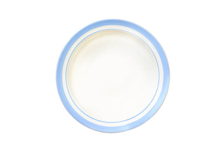 Top down white round deep ceramic soup plate with blue edges top view on isolated background with space for text. Copy space. Minimal style. Concept layout for labeling and food placement. Mockup.の写真素材