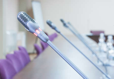 close up of a microphone in empty conference hallの写真素材