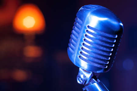 close up of  metal shining vintage style microphone on stageの写真素材