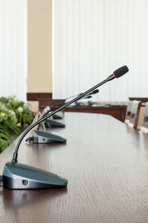 close up of a microphone in empty conference hall