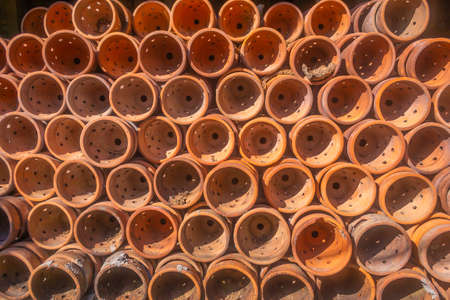 front  view of piles of traditional asian potteryの写真素材