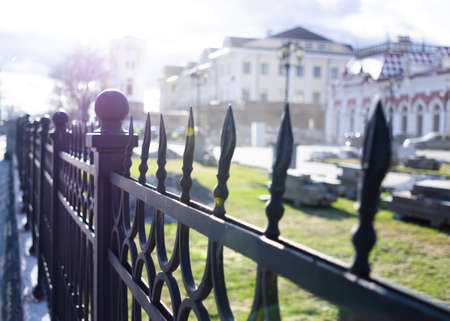 Mansion behind the fence in sunshineの写真素材
