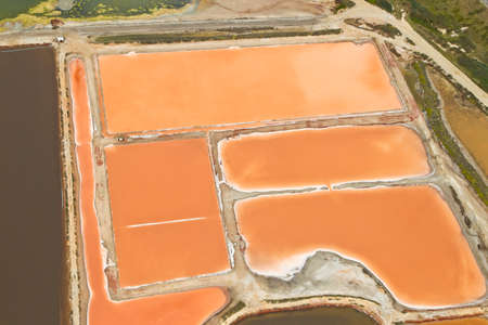 aerial view of salt pans with a orange look to itの写真素材