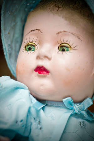 ancient cracked mannequin head with bonnet and shallow depth of fieldの写真素材