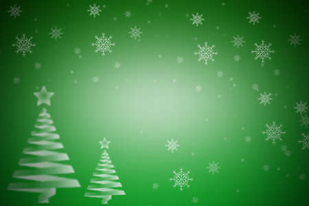 Green gradient background with snowflakes and Christmas treesの写真素材