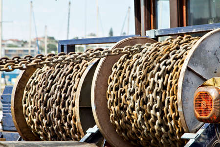 chains on a fishing vessel used to raise and lower the anchorsの写真素材