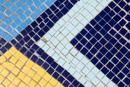 mosaic patterns of triangle shapes made with square blocks of yellowand different shades of blue