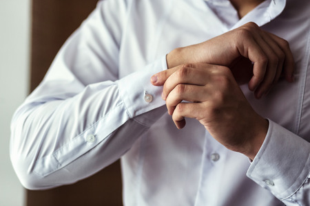 Businessman dress shirt. The man in the white shirt in the window dress cufflinks. Politician, man's...