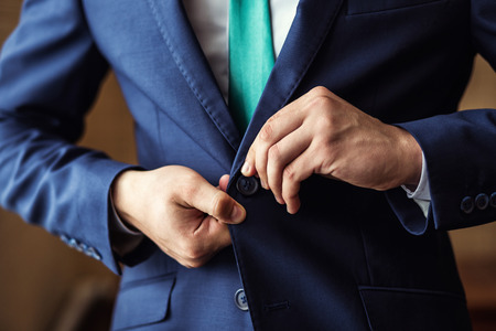 Businessman wears a jacket.Politician, man's style,male hands closeup, American, European businessman, business, fashion and clothing conceptの写真素材