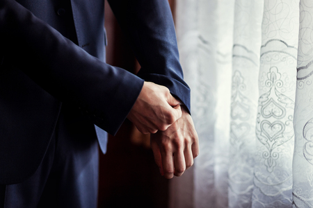 Businessman wears a jacket.Politician, man's style,male hands closeup, American, European businessman, business, fashion and clothing conceptの写真素材