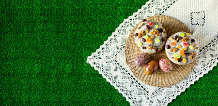 Easter cake and eggs on the green grass