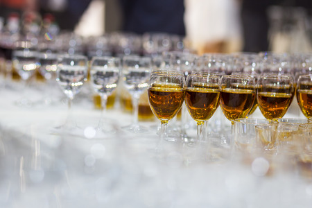 glasses with juice, champagne glasses, glasses with wine,catering banquet table, catering, stemware,red wine,whiskeyの写真素材