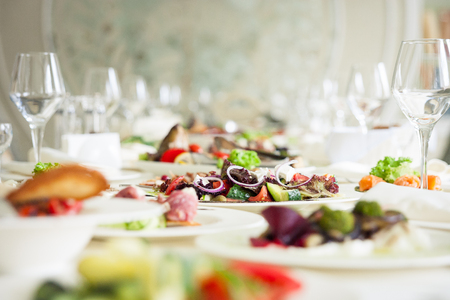 catering banquet table, Canapes on restaurant table, catering, buffet, canapés, stemwareの写真素材