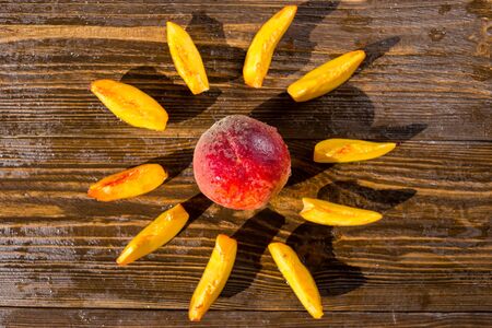 Fresh peaches, Peach close up fruit background, peach on wood background,sweet peaches,Peaches in the form of the sun,sliced peaches, peach slicesの写真素材