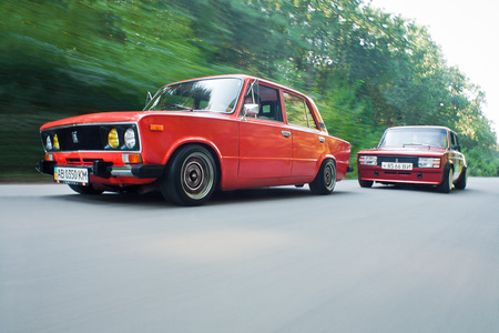 Vinnitsa,Ukraine - 04 August, 2012.Old Soviet car VAZ,Red retro car in motion.Red classic soviet motor car VAZ on road.Low Rider VAZ Cars,retro styleのeditorial素材