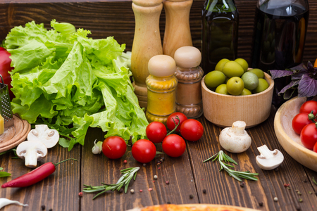 Pizza cooking ingredients. Dough, vegetables, cheese and spicesの写真素材