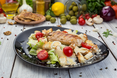 Healthy Grilled Chicken Caesar Salad with Cheese, Croutons and Cherry Tomatoesの写真素材