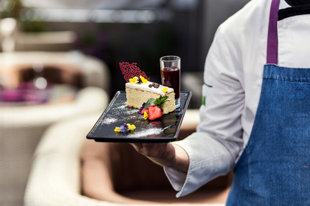 Restourant Chef presenting new dessert menu - cooking, profession, haute cuisine, food and people conceptの写真素材