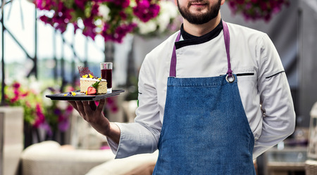 Restourant Chef presenting new dessert menu - cooking, profession, haute cuisine, food and people conceptの写真素材