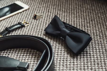 different accessories of a businessman for creating a style of a people lie on a wooden backgroundの写真素材