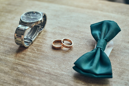 different accessories of a businessman for creating a style of a people lie on a wooden backgroundの写真素材