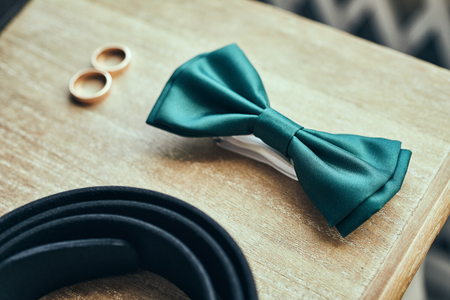 different accessories of a businessman for creating a style of a people lie on a wooden backgroundの写真素材