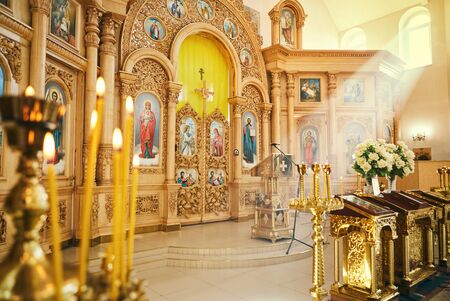 Vinnitsa,Ukraine - October 14,2018. Interior of the Orthodox church detail with candle and shrine and saint icon pictureのeditorial素材