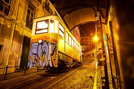 LISBON, PORTUGAL - December, 14: a night view of the historical Gloria Funicular (ascensor da gloria...