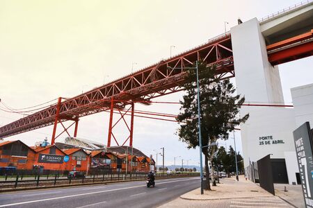 LISBON, PORTUGAL - December 12, 2018:  The 25 April bridge (Ponte 25 de Abril) is a steel suspension...