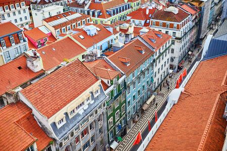 Lisbon Portugal - Beautiful panoramic view of the red roofs of houses in antique historical district Alfama and the Tagus River and bridge from Sao Jorge Castleの写真素材