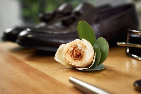 different accessories of a businessman for creating a style of a people lie on a wooden backgroundの写真素材