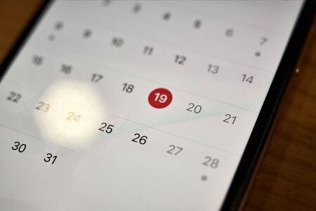 Close-up of smartphone with calendarの写真素材