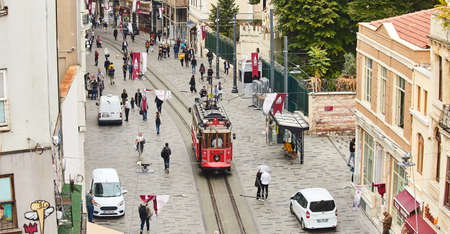 ISTANBUL, TURKEY â October 11, 2019 : Nostalgic traditional Red Tram in Beyoglu. Tramway line operates on Istiklal Street (popular destination in Istanbul) between Taksim Square and underground railway line - Tunnel.のeditorial素材
