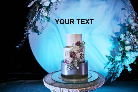 wedding festive multi-storey cake in white tone decorated with beautiful flowersの写真素材